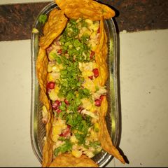 A picture of Salsa with nacho chips.