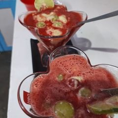 A picture of Watermelon mocktail with kulfi ice cream.