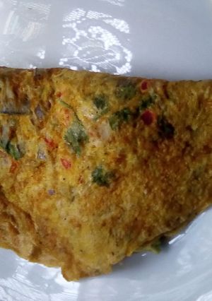 A picture of Turmeric omelette stuffed with fruits.
