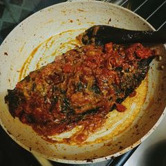 A picture of Fried fish in coconut sauce.