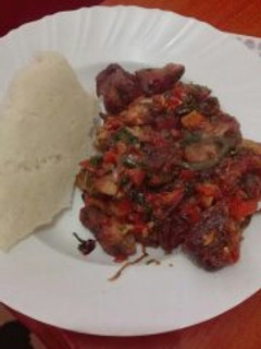 A picture of Fried Pork with Ugali.