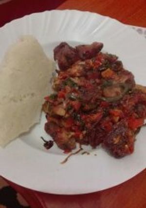 A picture of Fried Pork with Ugali.