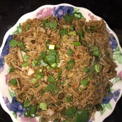 A picture of Fried rice-a chinese dish served with manchurian.