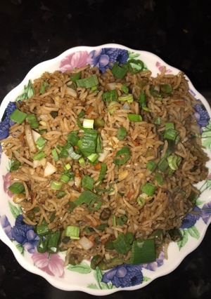 A picture of Fried rice-a chinese dish served with manchurian.