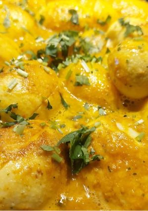 A picture of Egg curry with baby potatoes.