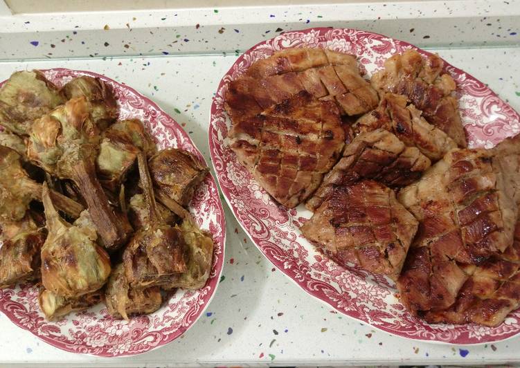 Secreto ibérico con alcachofas fritas