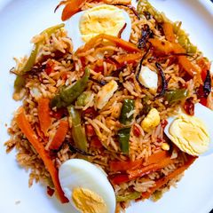 A picture of Egg pulao with veggies.