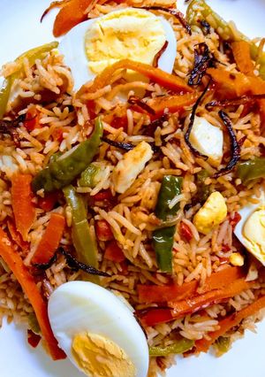 A picture of Egg pulao with veggies.