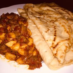 A picture of Savoury crepe and sauce.