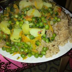 A picture of Rice and green peas.