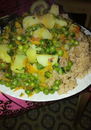 A picture of Rice and green peas.