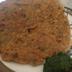 A picture of Mixed vegetable paratha with mint and coriander chutney.