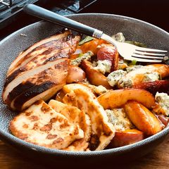 A picture of Chili, honey grilled nectarine on blue cheese salad bed with grilled Halloumi & Grilled Chicken.