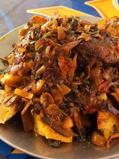 A picture of Roasted yam and plantain with ugba.