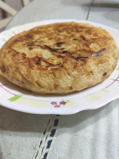 Una foto de Tortilla de patatas con cebolla