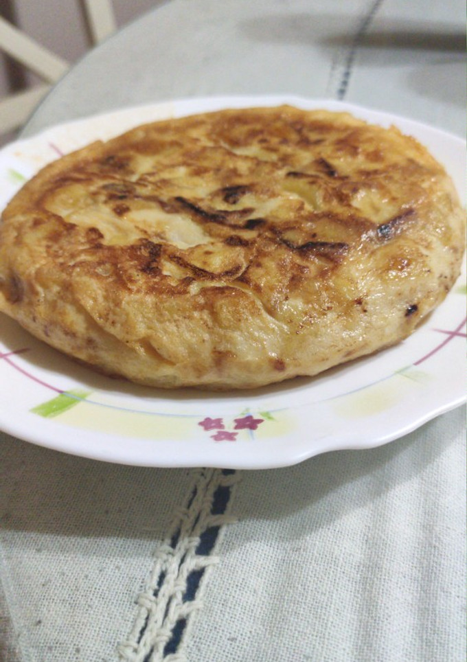Una foto de Tortilla de patatas con cebolla