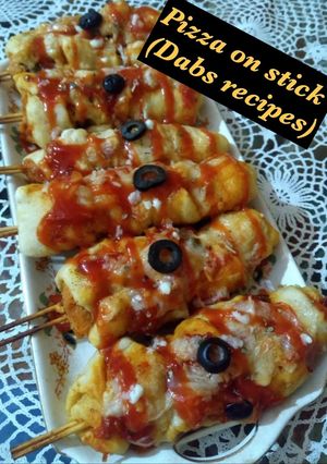 A picture of Pizza on stick.