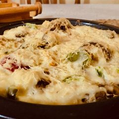 A picture of Baked mushrooms with bell peppers.