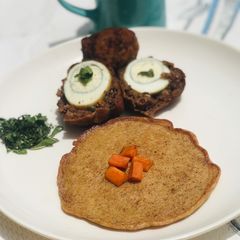 Fried scotch egg 🥚 with breadcrumb pancake 🥞 A picture of Fried scotch egg 🥚 with breadcrumb pancake 🥞.