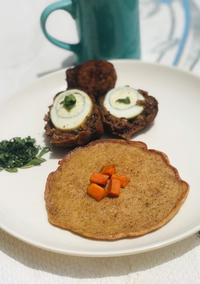 A picture of Fried scotch egg 🥚 with breadcrumb pancake 🥞.