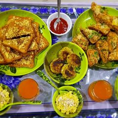 A picture of Masala toast, garlic cheese toast,poha cutlet and egg halwa.