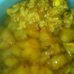 A picture of My potatoes an egg sauce.
