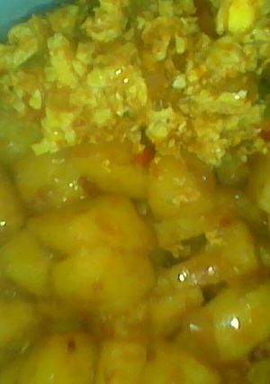 A picture of My potatoes an egg sauce.