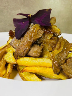 Una foto de Lomito con cebolla caramelizada Nicole