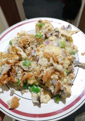 A picture of Cheese, Mushroom, onion and pepper omelette.