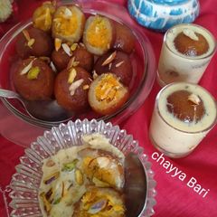 A picture of Stuffed Gulab jam with coconut jaggery.