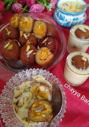 A picture of Stuffed Gulab jam with coconut jaggery.
