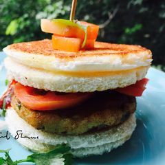 A picture of Alu paneer tikki burger.