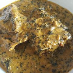 A picture of Egusi and bitterleaf soup.