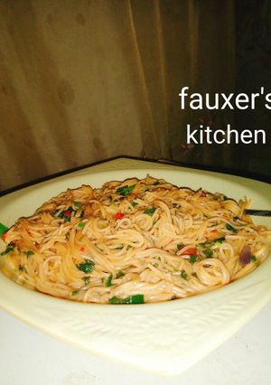 A picture of Spinach spaghetti jollof.