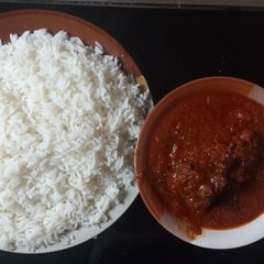 A picture of White rice and stew.