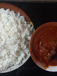 A picture of White rice and stew.