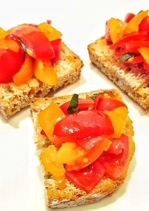 A picture of Bruschetta with Red and Yellow Datterini Tomatoes.