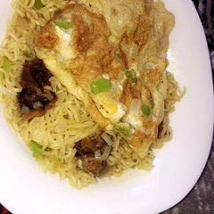A picture of Indomie noodles with egg.