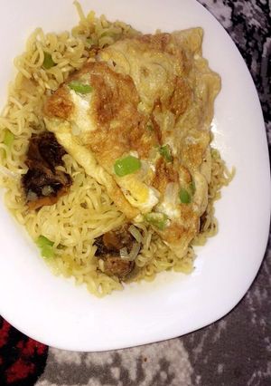 A picture of Indomie noodles with egg.