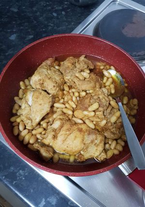 A picture of Seasoned chicken and beans.