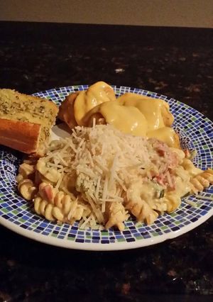 A picture of Brad's chicken sausage pasta w/ tomato, basil, vodka cream sauce.