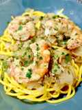 Spaghetti cúrcuma con gambón a la naranja