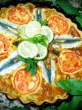 Sardine quiche, sliced ​​tomatoes