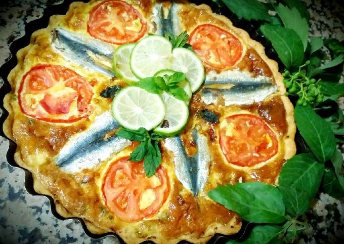 Sardine quiche, sliced ​​tomatoes