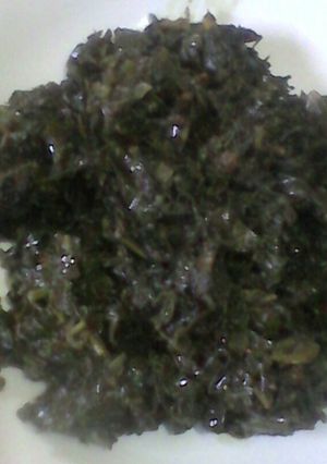 A picture of Fried mnavu and mchicha leaves(black nightshade+amaranth).