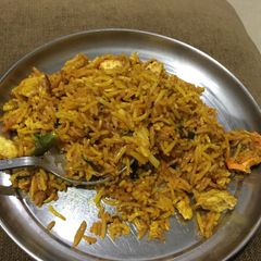 A picture of Chicken and Egg Pulav with Leftover chicken tikka and rice.
