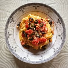 A picture of Linguine with Tomatoes, Capers and Olives.
