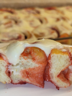 A picture of Strawberry Rolls with Lemon Cream Cheese Glaze.