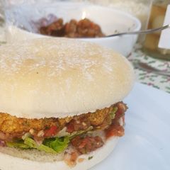 A picture of Chickpea burgers with spicy tomato salsa.