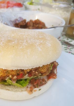 A picture of Chickpea burgers with spicy tomato salsa.